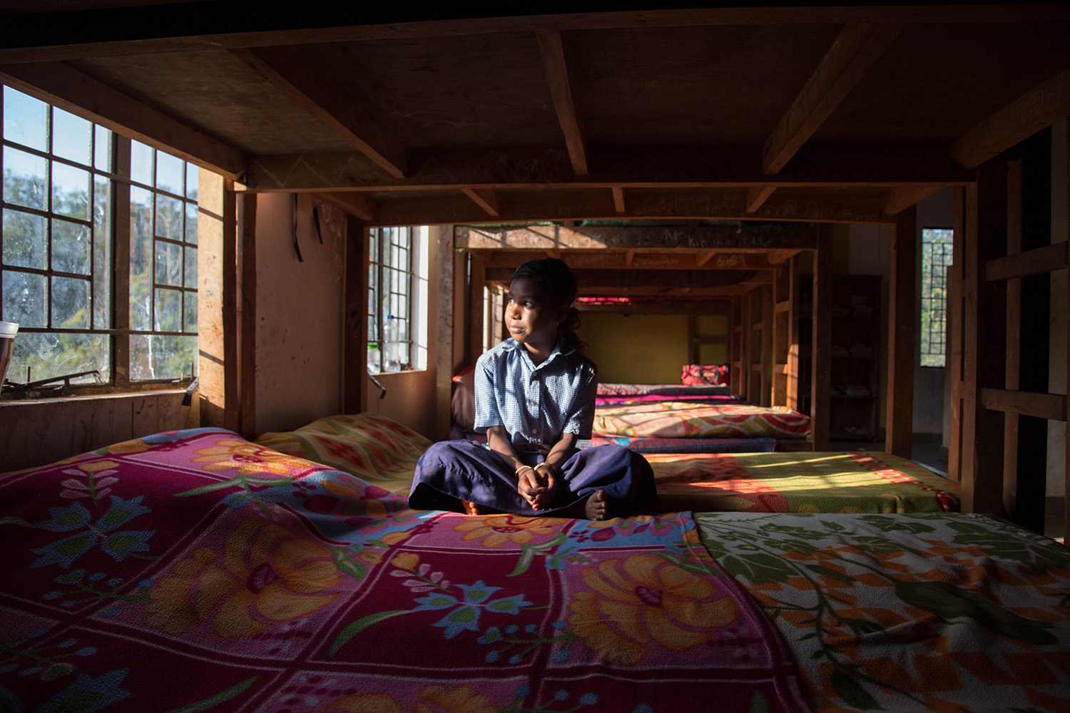 Janaki sits by the window at the girls’ dormitory. She could one day follow in the footsteps of her predecessors, a handful of whom are now doing university degrees.
