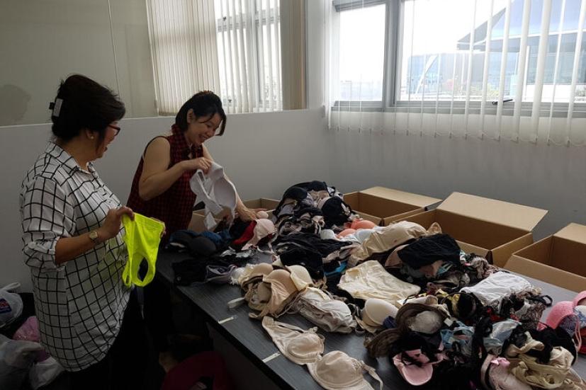 Volunteers sorting and packing the donated bras in Singapore in 2016